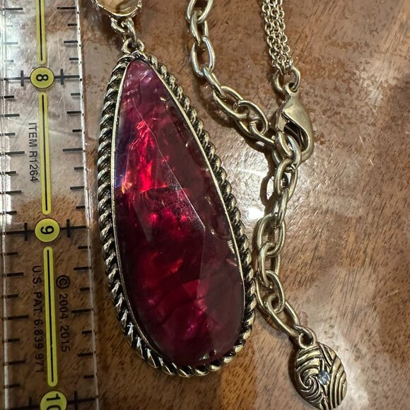 Gold-tone statement necklace featuring multi-colored faux gemstone stations - Picture 6 of 8